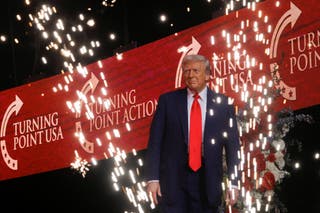 U.S. President Donald Trump takes the stage to deliver remarks during a memorial service for slain conservative commentator Charlie Kirk at State Farm Stadium, in Glendale, Arizona, U.S., September 21, 2025